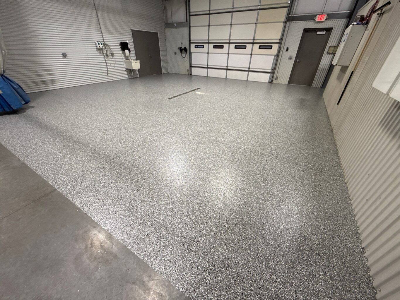 Completed Penntek polyurea and polyaspartic floor in Andover Auto Body shop, durable and easy to maintain.
