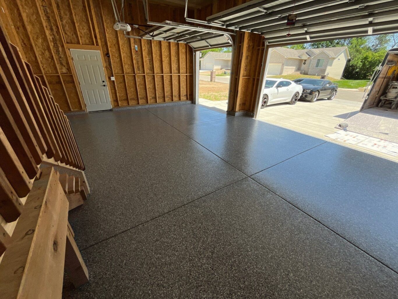 Wide view of garage floor coating showing seamless Penntek surface and even texture.